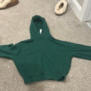 Dark green cropped scuba hoodie from Lululemon